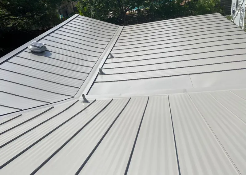 Solar attic fan installed on a metal roof for Roof Ventilation in Zephyrhills